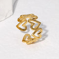 Gold heart-shaped ring on a white background