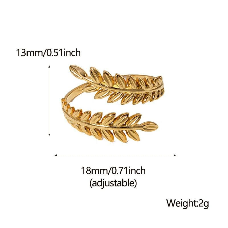 Gold leaf-shaped ring with measurements and weight details on a white background