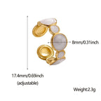 Gold and white stone ring with measurements and weight details on a white background
