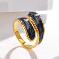 Gold and black ring on a white background