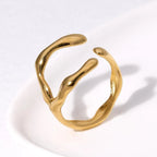 Gold open ring on a white background