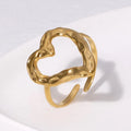 Gold ring with a textured design on a white background