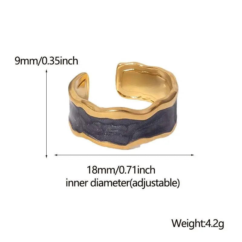Gold and black adjustable ring with measurements on a white background